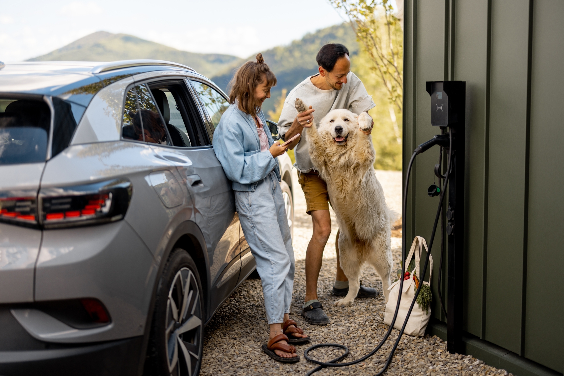 young-couple-with-a-dog-near-house-and-car-2024-08-06-02-42-59-utc